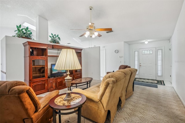 living room with ceiling fan, light colored carpet, a textured ceiling, and vaulted ceiling