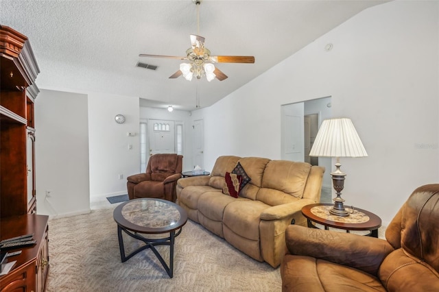 carpeted living room with a textured ceiling, ceiling fan, and lofted ceiling