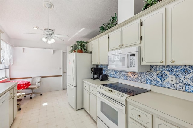 kitchen featuring ceiling fan, white appliances, a textured ceiling, and tasteful backsplash