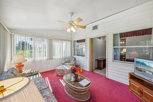 sunroom / solarium featuring ceiling fan and vaulted ceiling