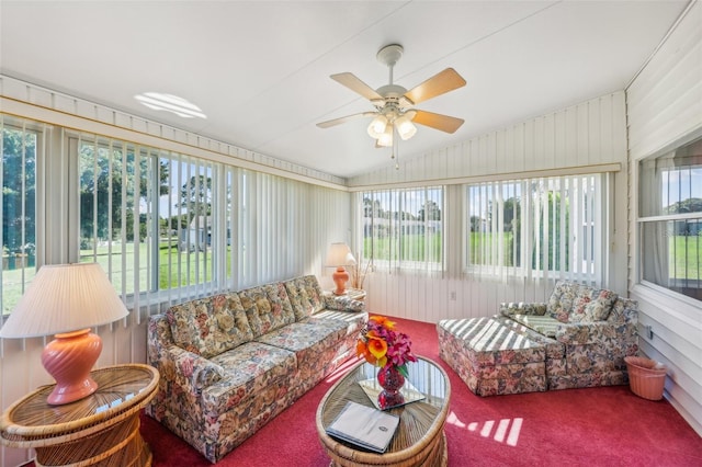 sunroom / solarium with ceiling fan and lofted ceiling