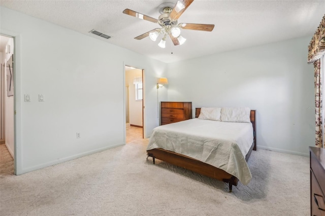 bedroom featuring ceiling fan and light carpet