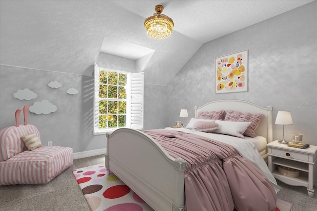 bedroom with a textured ceiling, carpet, and vaulted ceiling