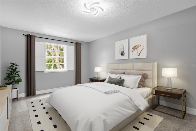 bedroom with a textured ceiling and light carpet