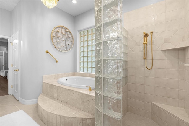 bathroom with tile patterned flooring and independent shower and bath