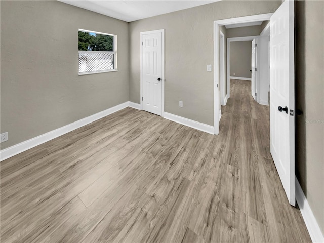 unfurnished bedroom with light hardwood / wood-style floors