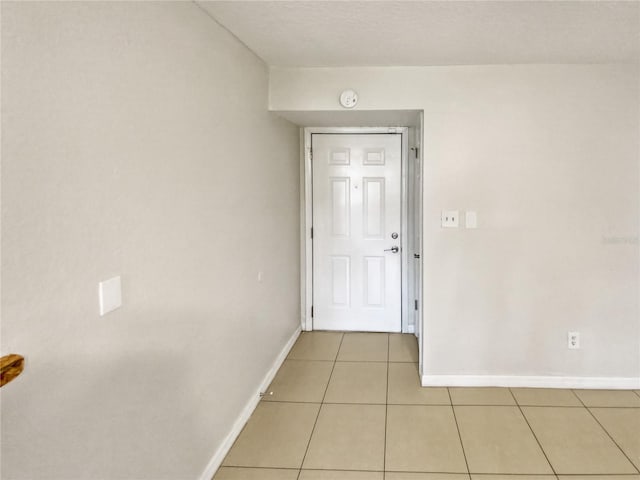 entryway with light tile patterned floors