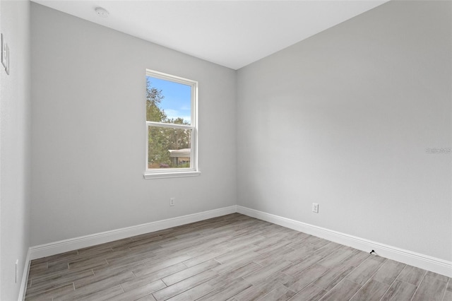 unfurnished room featuring light hardwood / wood-style flooring