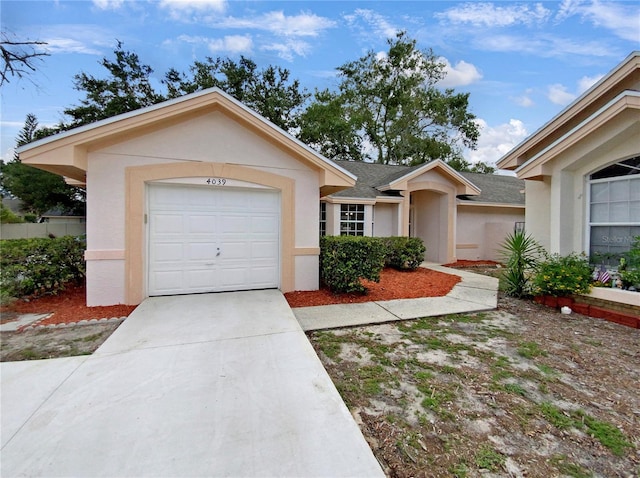 single story home with a garage