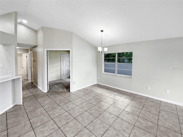 unfurnished room featuring light tile patterned floors, high vaulted ceiling, and a notable chandelier