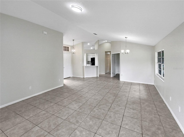 unfurnished living room with light tile patterned floors, lofted ceiling, and a notable chandelier