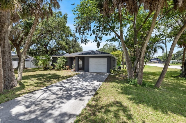 view of front facade featuring a garage and a front lawn