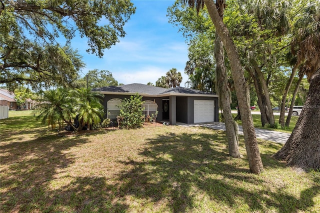 exterior space with a garage and a front yard