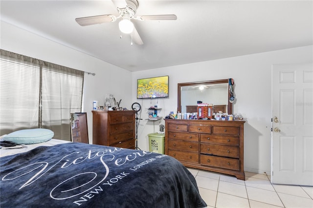 bedroom featuring ceiling fan and light tile patterned floors