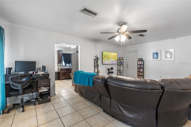 tiled living room with ceiling fan