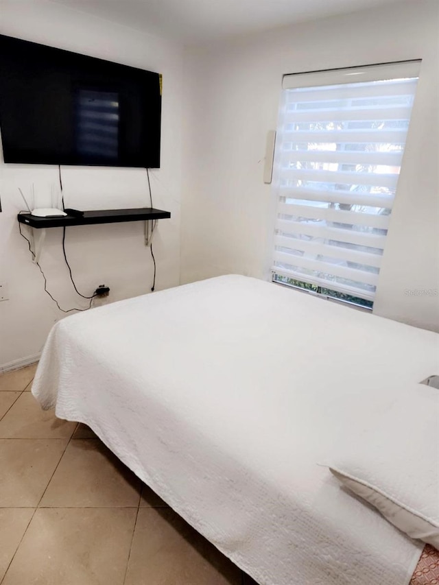 bedroom featuring light tile patterned floors