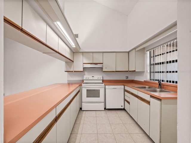 kitchen featuring white cabinetry, white appliances, sink, and light tile patterned floors