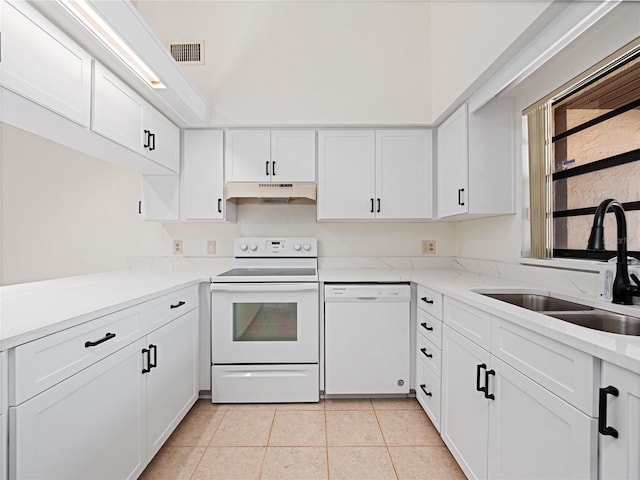 225 Terrace Hill Blvd Unit 1C, Debary, FL 32713 - kitchen with white appliances, a sink, under cabinet range hood, white cabinetry, and light tile patterned floors