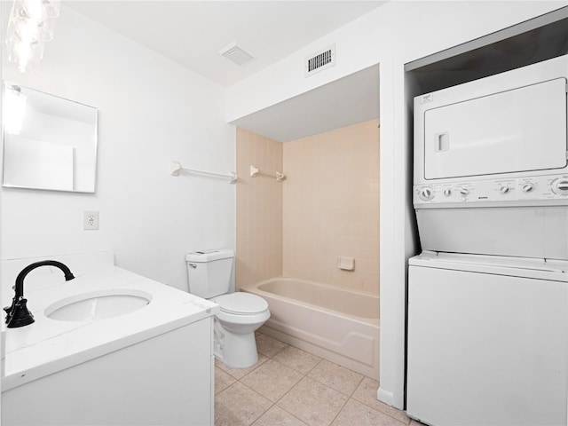 225 Terrace Hill Blvd Unit 1C, Debary, FL 32713 - full bath featuring estacked washer and dryer, tile patterned floors, toilet, vanity, and shower / bath combination