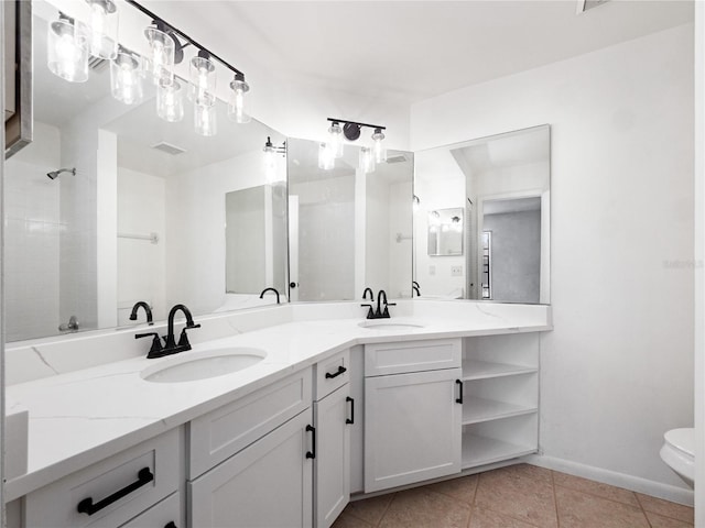 225 Terrace Hill Blvd Unit 1C, Debary, FL 32713 - full bath with double vanity, tile patterned floors, baseboards, toilet, and a shower
