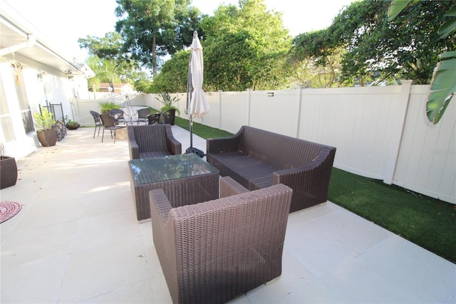 view of patio / terrace featuring outdoor lounge area and a fenced backyard