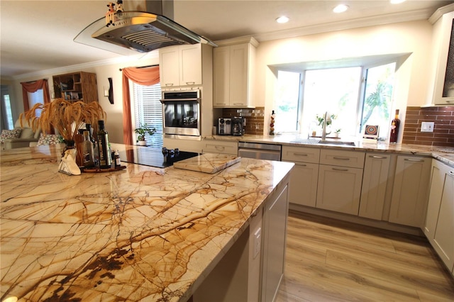 kitchen with decorative backsplash, stainless steel appliances, crown molding, and extractor fan