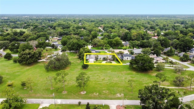 birds eye view of property with a forest view