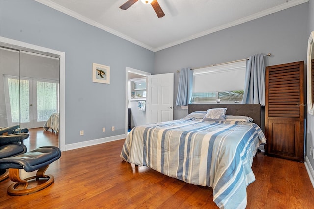 bedroom featuring crown molding, baseboards, ceiling fan, and dark wood-type flooring