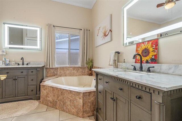 bathroom with ornamental molding, tile patterned flooring, two vanities, and a sink