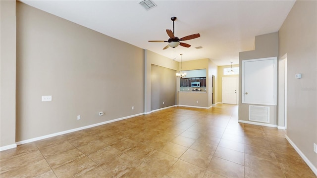 unfurnished living room featuring light tile patterned flooring and ceiling fan with notable chandelier