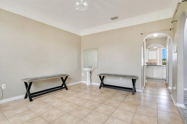 interior space with crown molding