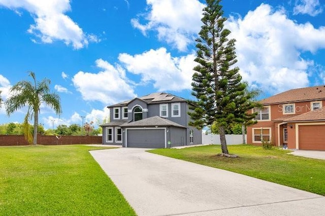 view of front of property with a front yard and solar panels