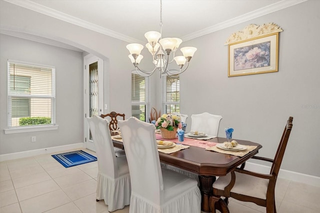 dining area featuring plenty of natural light, light tile patterned floors, a chandelier, and ornamental molding