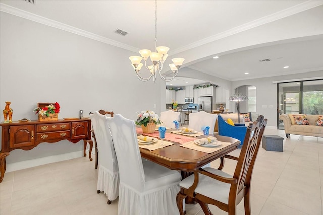 dining room featuring ornamental molding and a chandelier