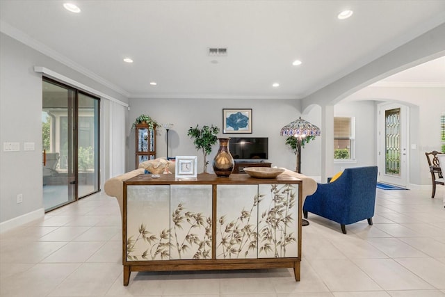 living room featuring crown molding and light tile patterned floors