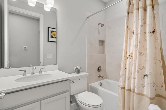 full bathroom with shower / bath combination with curtain, vanity, and toilet