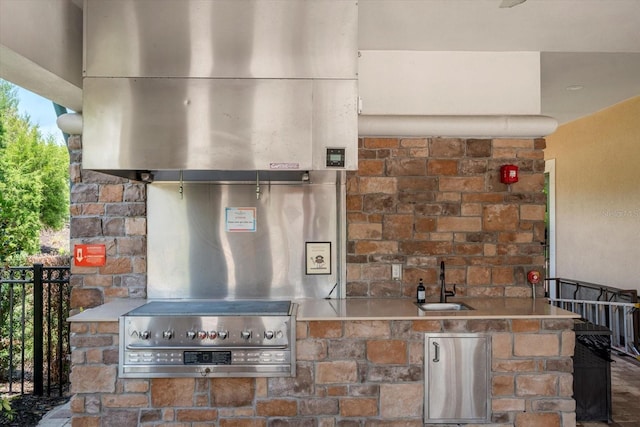 kitchen with sink and range hood