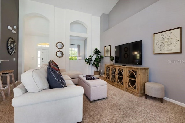 4036 Oakrise Loop, Davenport, FL 33837 - living area with baseboards, carpet, and high vaulted ceiling