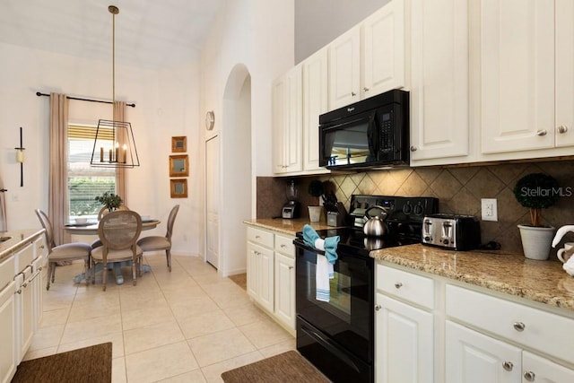 kitchen featuring white cabinetry, black appliances, backsplash, and light tile flooring