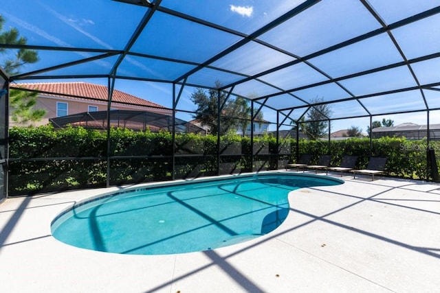 view of pool featuring a patio area and a lanai