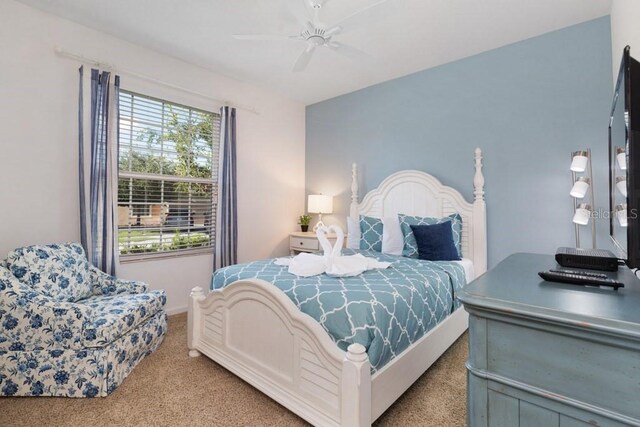 4036 Oakrise Loop, Davenport, FL 33837 - bedroom featuring carpet floors, a ceiling fan, and baseboards