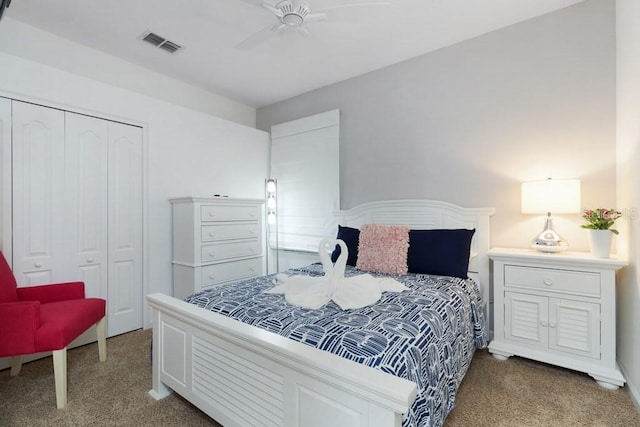 carpeted bedroom with a closet and ceiling fan