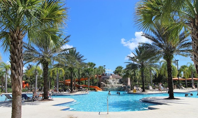 view of pool with a water slide