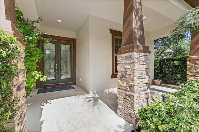 view of exterior entry featuring a porch