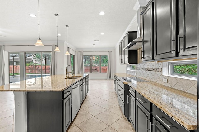 kitchen featuring a large island, pendant lighting, light stone counters, sink, and backsplash