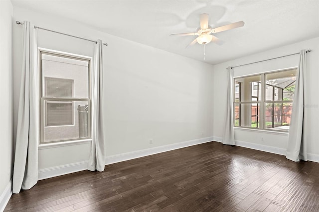 unfurnished room featuring dark hardwood / wood-style flooring and ceiling fan