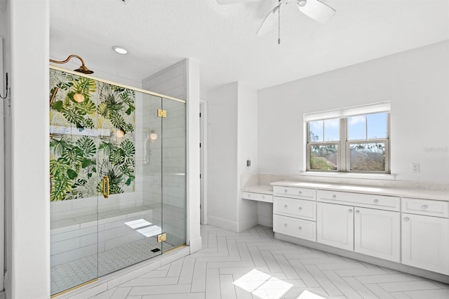 bathroom featuring walk in shower, parquet flooring, vanity, and ceiling fan