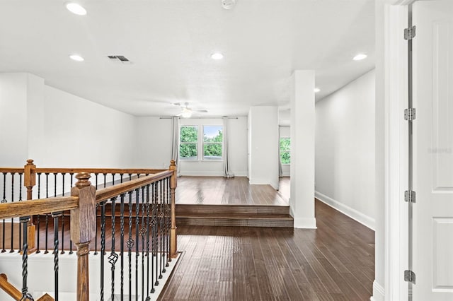 hall with wood-type flooring