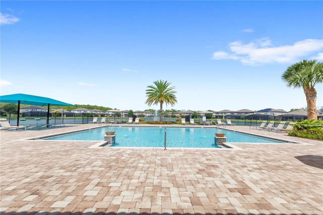 view of swimming pool featuring a patio area