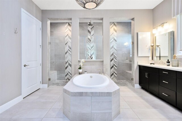 bathroom with vanity, tile patterned floors, and shower with separate bathtub